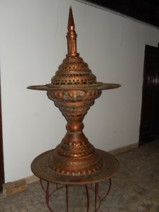 This object dates back to Ottoman times. A charcoal fire was lit in the upper section,,and coffee and foodstuffs was kept warm on the tray.  Cool items were placed on the lower tray