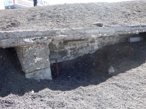 Ash covering an old wall on top of Mount Etna