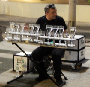 Glass player outside our hotel at night