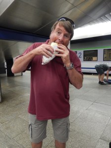 Waddy stuffing down lunch as he waits for the train to Lublin
