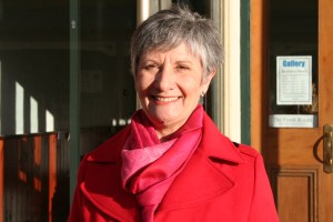 Gwen in red coat and scarf