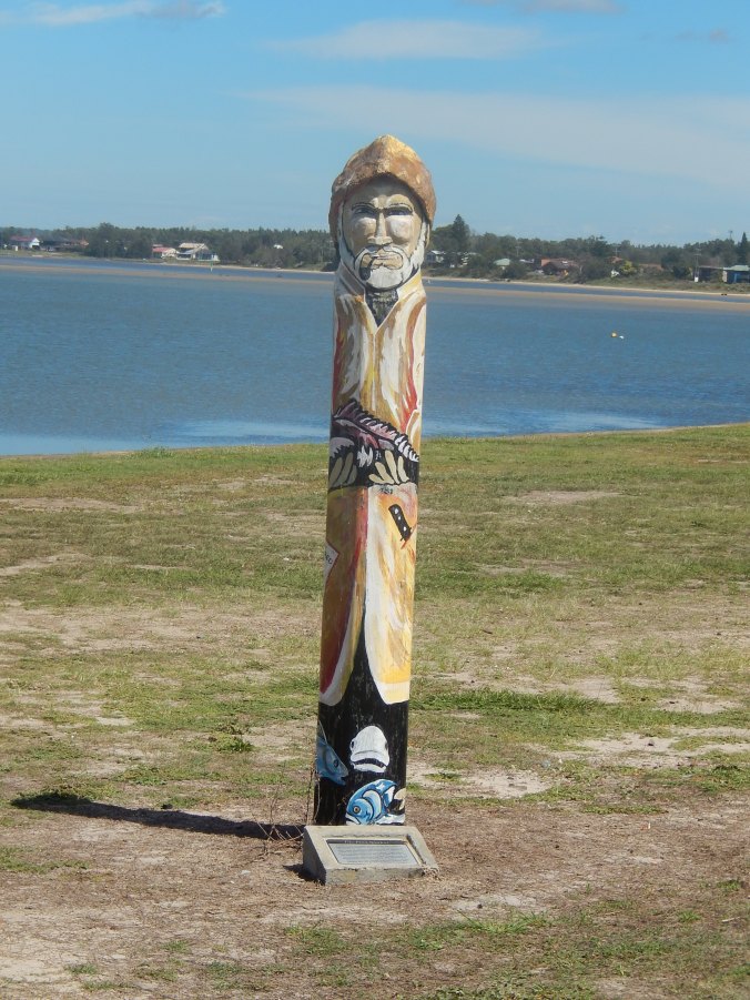 Sculptures by the waterfront represent figures in the maritime history