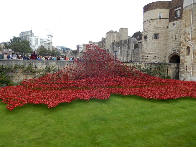 Poppies commemorating WWI at the Tower of London. In this part of the display, the poppies stream down the embankment like a river of blood