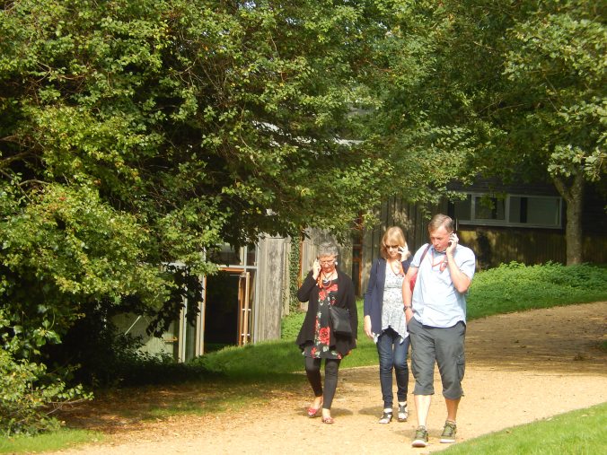 This looks as if we are talking to each other on our mobile phones but in reality we are listening to the audio commentary on the Battle of Hastings 