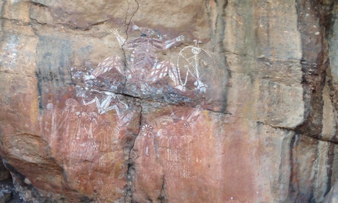 This is a complex piece with several figures, each part of a larger story. The largest figure is Namarndjolg, who violated clan laws, and later became Ginga, the great saltwater crocodile